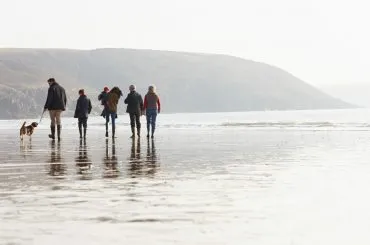 Family walking on beach