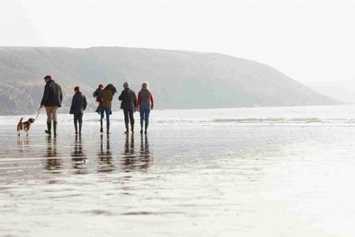 Family walking on beach